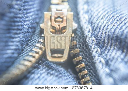 Close Up Of Unbuttoned And Unzipped Blue Denims. Zip Lock Close Up.