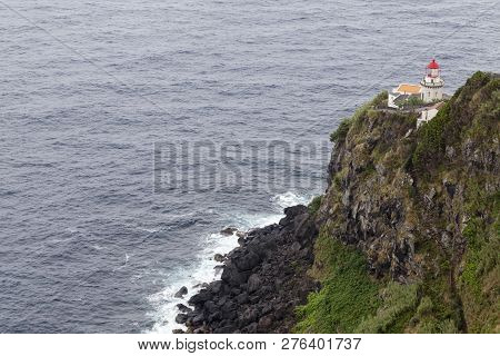 Beautiful View Of The Faro Do Arnel Lighthouse Near Nordeste On Sao Miguel.