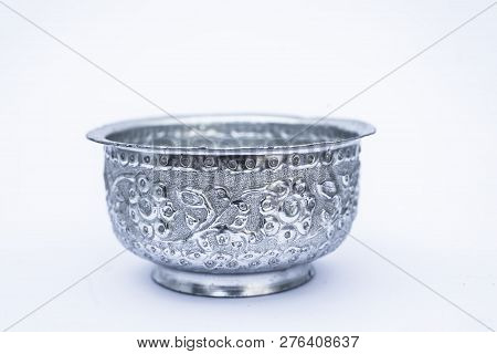 Close Up Of White Or Silver Colored Shiny Container Isolated On White.