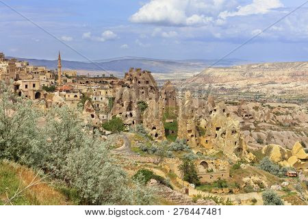 Quarter Of Ancient Antique Residential Caves And Turkish Mosque On The Background Of The Mountain Ra