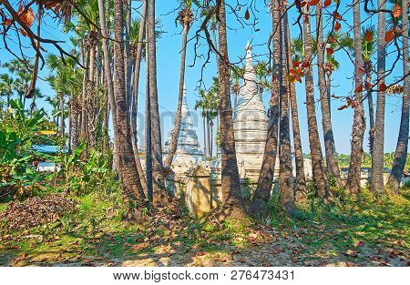 Walk In Garden Of Old Bagaya Monastery With A View On Carved Stupas, Decorated With Fine Patterns An