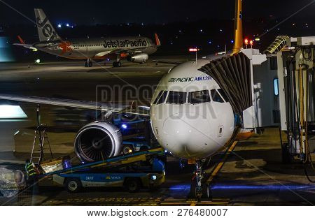 Passenger Airplane At The Night Airport