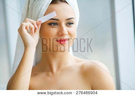 Hair Removal Wax. Young Woman Reciving Facial Epilation