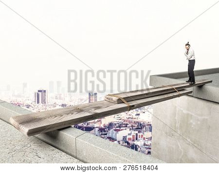 businessman looking improvide bridge and he is thinking what to do