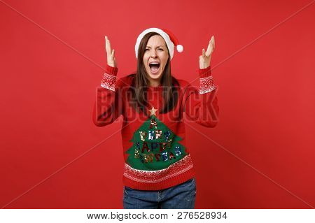 Angry Dissatisfied Santa Girl In Knitted Sweater, Christmas Hat Spreading Hands, Screaming Crying Is