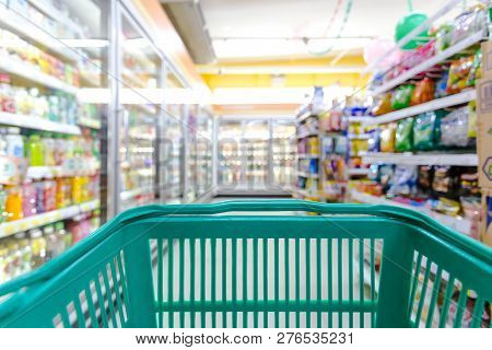 Closeup Shopping Basket Green Color With Blurred Suppermarket Background