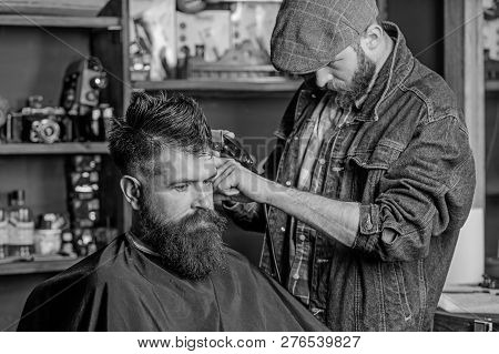 Hipster Lifestyle Concept. Hipster Client Getting Haircut. Barber With Hair Clipper Work On Hairstyl