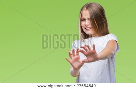 Young beautiful girl over isolated background disgusted expression, displeased and fearful doing disgust face because aversion reaction. With hands raised. Annoying concept.