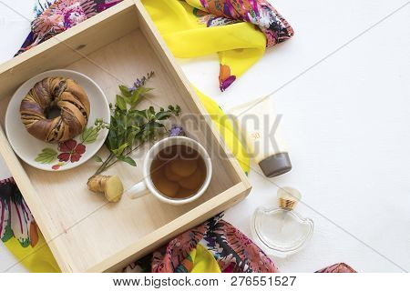 Yellow Scarf ,sunscreen Spf50 ,perfume ,ginger Tea ,bread In Wooden Box Of Lifestyle Woman Relax On 