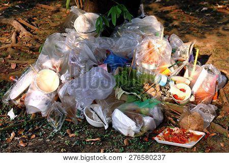 Waste Plastic, Garbage, Dump, Pile Junk Wet Food Waste Plastic Bags At The Base Of The Tree, Waste P