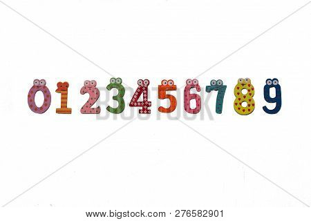 Multi-colored Numbers From Zero To Nine Are Isolated On A White Background. Wooden Figures. Fun Colo