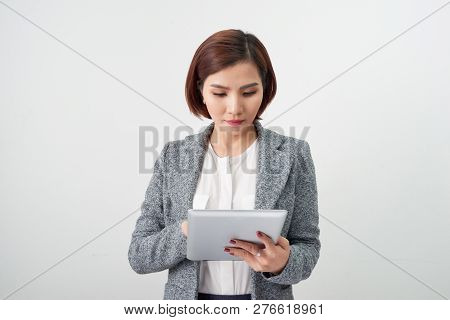 Young Business Woman With Digital Tablet In Office Lobby