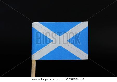 A Unique Flag Of Scotland On Toothpick On Black Background. A Blue Field With A White Diagonal Cross