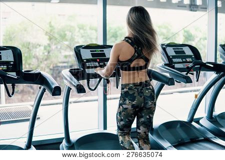 Young Fit Woman Doing Running Exercise In Gym