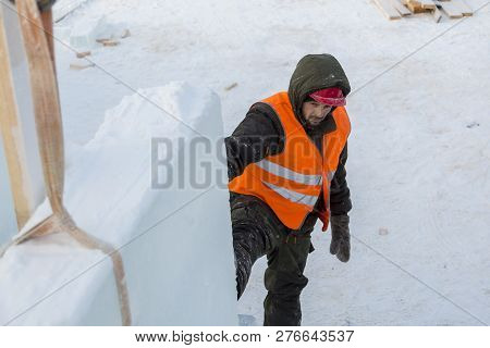 Slinger In An Orange Helmet At The Installation Site