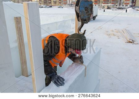 Slinger In An Orange Helmet At The Installation Site