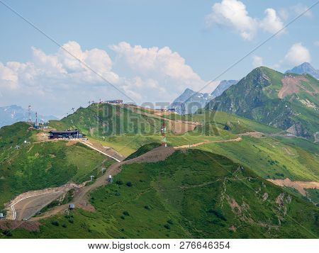 Serpentine Road To The Top Of A High Mountain Range With Cable Cars. Krasnaya Polyana, Sochi, Russia
