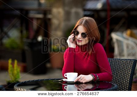 Lifestyle Fashion Portrait Of Young Stylish Hipster Woman Walking On The Street.