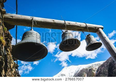 Bells In Lamaria Church In Zhibiani - Ushguli Community Of Villages, Upper Svaneti, Georgia. Snow Co