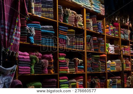 The Colorful Cloacks On The Shelves In The Store