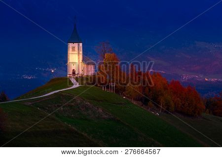 Autumn Night Panorama With Saints Primus And Felician Church On Top Of Hill In Jamnik, Slovenia Coun