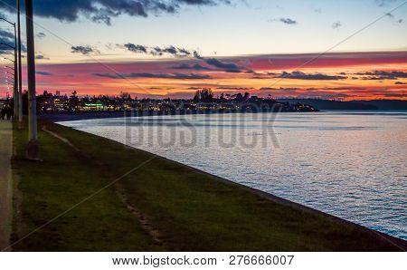 The Sky Is Rich With Colors As The Sun Set At Alki Beach In West Seattle, Washington.