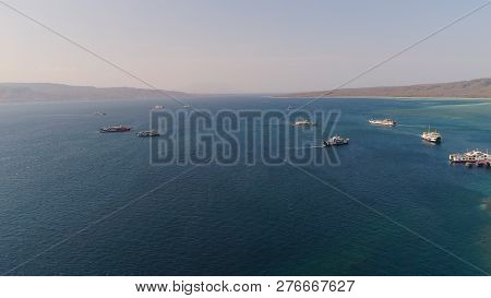 Aerial View Ferry Port Gilimanuk With Ferry Boats, Vehicles. Ferries Transport Vehicles And Passenge
