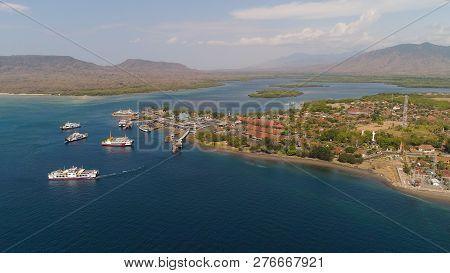 Aerial View Ferry Port Gilimanuk With Ferry Boats, Vehicles. Ferries Transport Vehicles And Passenge