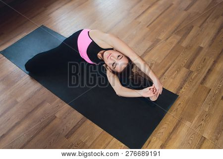 Young Woman Practicing Yoga, Stretching In Variation Of Reverse Table Top Exercise, Bridge Pose, Wor