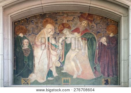 ZURICH, SWITZERLAND - JUNE 23, 2018: Holy Trinity and saints Felix and Regula, fresco on the Fraumunster church in Zurich, Switzerland