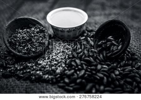 Close Up Of Paste Of Custard Apple Seeds In A Glass Bowl With Some Powdered Seeds And Raw Dried Seed