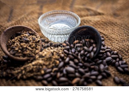 Home Remedy To Cure Lice Or Joon On Brown Colored Surface I.e. Custard Apple Seeds Dried And Powdere