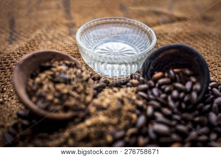 Home Remedy To Cure Lice Or Joon On Brown Colored Surface I.e. Custard Apple Seeds Dried And Powdere
