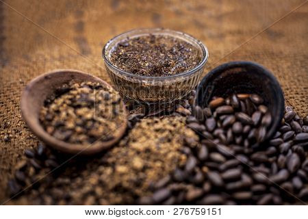 Home Remedy To Cure Lice Or Joon On Brown Colored Surface I.e. Custard Apple Seeds Dried And Powdere