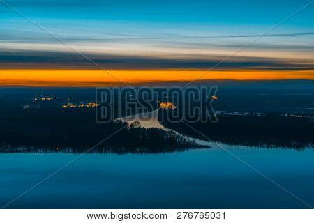 Beautiful River With Big Island With Trees Under Predawn Sky. Bright Orange Stripe In Picturesque Cl