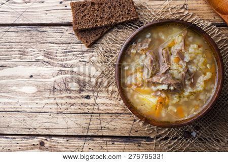 Kharcho Soup With Meat And Rice On Wooden Table