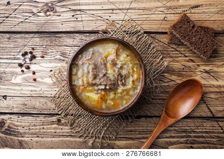 Kharcho Soup With Meat And Rice On Wooden Table