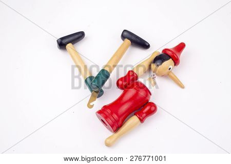 Toy Puppet Broken Pinocchio On White Background