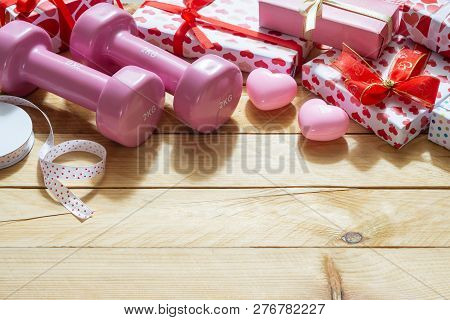 Pink Sport Dumbbells, Heart Models And Gift Boxes On Wooden Background, Valentines Sports Background
