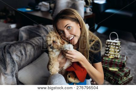 Happy Family Of Blonde Woman And Her Little Doggy Son. Having Fun Together T Home On Winter Holidays