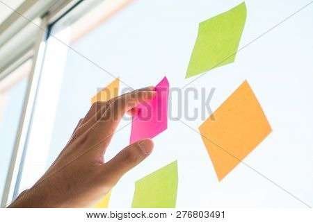 Business People Hands Post Sticky Note Paper On Glass Reminder Schedule Board For Meeting At Office 