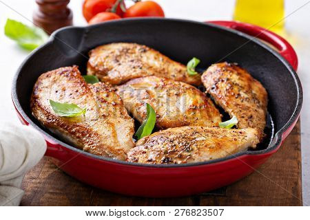 Cooked Chicken Breast Seared In A Cast Iron Skillet