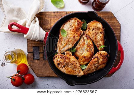 Cooked Chicken Breast Seared In A Cast Iron Skillet Overhead