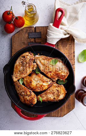 Cooked Chicken Breast Seared In A Cast Iron Skillet Overhead