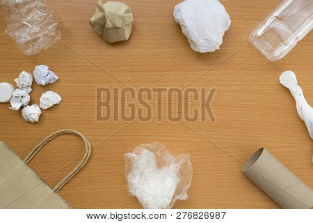 Top View Of Recycling Garbage Waste On Wooden Background With Center Copy Space , Eco And Save World