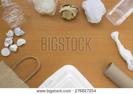 Top View Of Recycling Garbage Waste On Wooden Background With Copy Space , Eco And Save World Concep