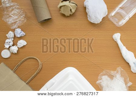 Top View Of Recycling Garbage Waste On Wooden Background With Center Copy Space , Eco And Save World