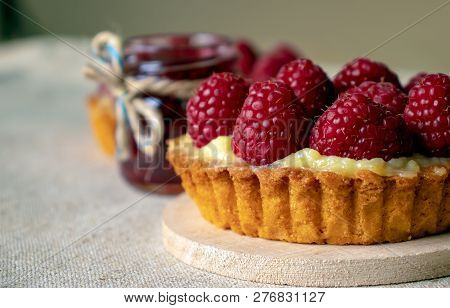Raspberry Cake-tart And Raspberry Jam Close-up On Wooden Background