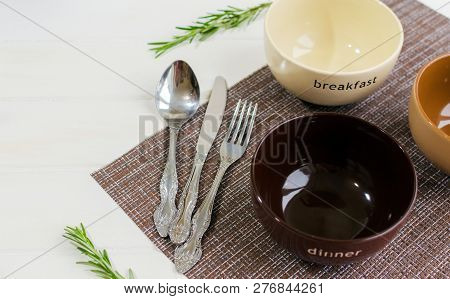 Set Of Bowls With Fork, Spoon And Knife. Written Breakfats, Lunc