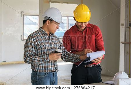 Team Of Business People In Group, Architect And Engeneer On Construciton Site Check Documents And Bu